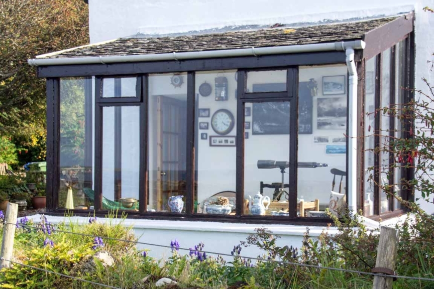 Sunrooms are becoming so much more popular across the UK, no doubt as a result of improved insulation technology. This one is obviously set up to monitor shipping with the prominent telescope. Isle of Skye, Broadford Bay - Sunroom