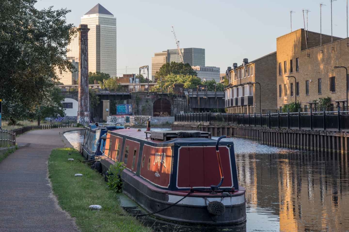 Narrowboats, Spires and Railway Bridge 60 between Mile End and the Thames river. Railway-Bridge-60