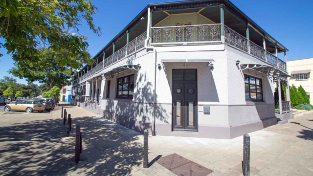 Built 1868-1950; Two storey brick building, hipped corrugated iron roof, verandahs with timber posts, cast iron balustrades and friezes; 116 Wharf Street; Qld Register #600715 Queensland Pubs