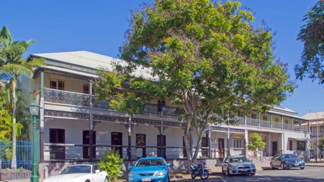 Built 1868-1950; Two storey brick building, hipped corrugated iron roof, verandahs with timber posts, cast iron balustrades and friezes; 116 Wharf Street; Qld Register #600715 Queensland Heritage-listed Hotels (Pubs)